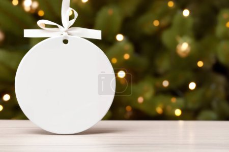 Photo for Round Ceramic ornament with ribbon bow. Christmas ornament mock up - Royalty Free Image