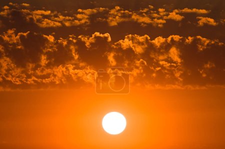 Photo for Cloudy sky and bright sunrise over the horizon. - Royalty Free Image