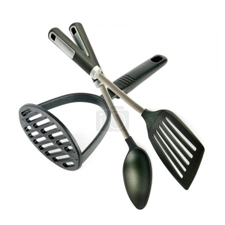 Kitchen utensils, potato masher, spatula and spoon isolated on white background. Collage.