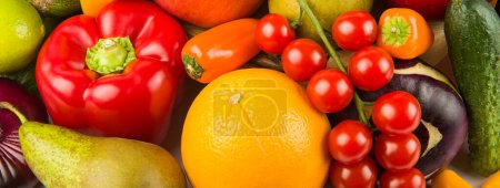 A set of fruits and vegetables. Bright background. Wide photo.