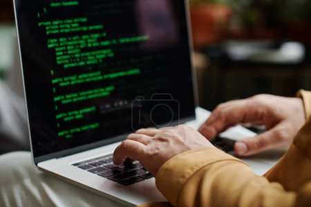 Photo for Hands of modern programmer or software developer typing on laptop keyboard while decoding data or working over new IT project - Royalty Free Image