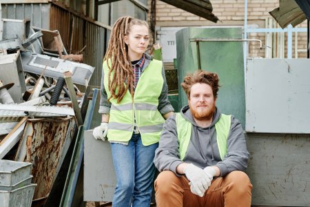Photo for Couple in neon vests working at materials recovery facility - Royalty Free Image