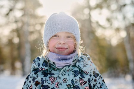 Photo for Happy youthful girl with blond hair standing in front of camera in natural environment and enjoying winter weekend or vacation - Royalty Free Image