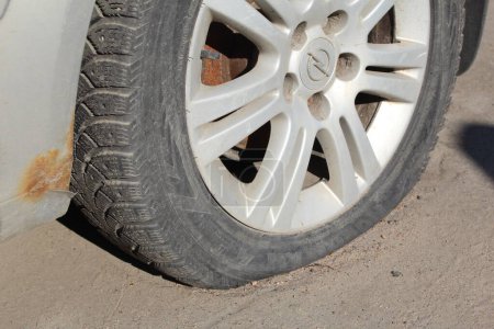 Photo for Flat car tire close up, punctured wheel - Royalty Free Image