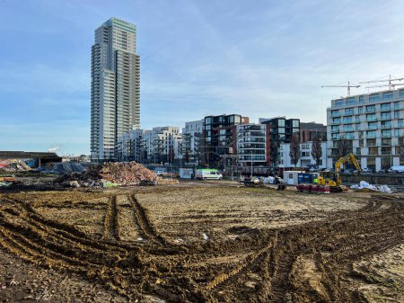 Foto de Brussels, Belgium - 1 February 2023: A landscape along the canal that runs through the city of Brussels. This mixed area of housing, greenery and industry is being worked on for redevelopment. - Imagen libre de derechos