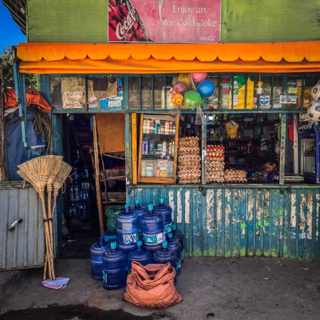 Foto de Addis Ababa, Ethiopia - 8 January 2023: Colorful small grocery shop in Addis Ababa, Ethiopia - Imagen libre de derechos