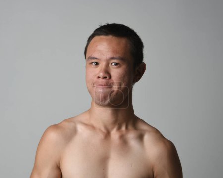 Photo for Close up portrait of asian male model, expressive and  exaggerated  facial expressions and silly faces. Isolated on a white studio background - Royalty Free Image