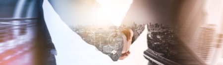 Photo for Mixed media effect Double exposure businessman handshake business deal to partner successfully negotiated and commercial cooperation and trade cityscape blurred background panoramic header banner - Royalty Free Image