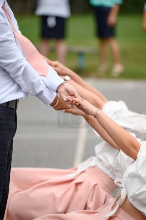 Photo for Couple close-up holding hands, family expressing sympathy and understanding, young man's hands. - Royalty Free Image