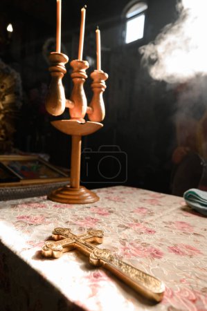 Photo for Sunlight brightens the iconostasis in the temple, light falls on the candlestick on the throne. - Royalty Free Image