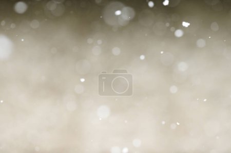 Photo for Bokeh of white snow on a light background. Falling snowflakes, isolated for post production and overlay in graphic editor. - Royalty Free Image