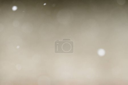 Photo for Bokeh of white snow on a light background. Falling snowflakes, isolated for post production and overlay in graphic editor. - Royalty Free Image
