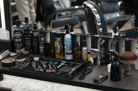 Photo for Ivano-Frankivsk, Ukraine February 23, 2024: view of a table with working equipment in a barbershop, top view of the table. - Royalty Free Image