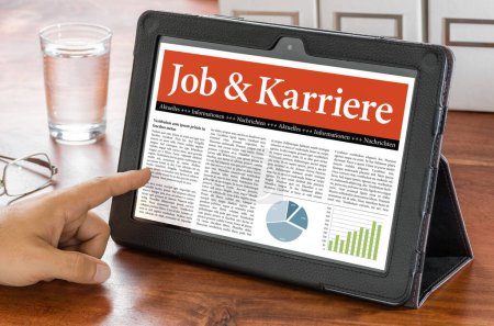 A tablet computer on a desk - Job and Career - Job und Karriere German