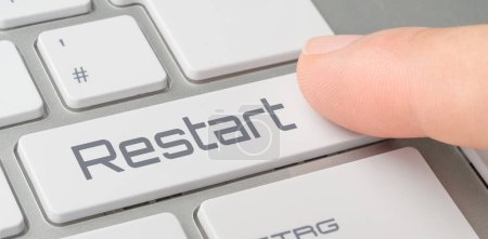 A keyboard with a labeled button - Restart