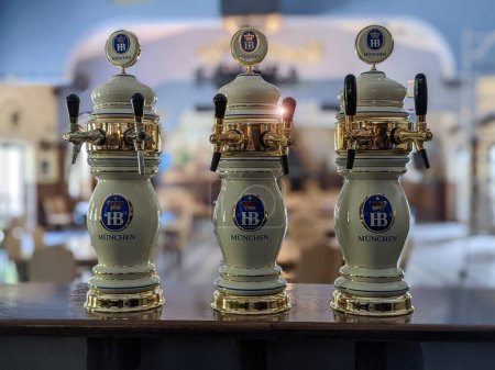 Photo for Rikoti, Georgia, May, 27, 2022: Hofbrau beer pumps or taps inside a restaurant, selective focus - Royalty Free Image