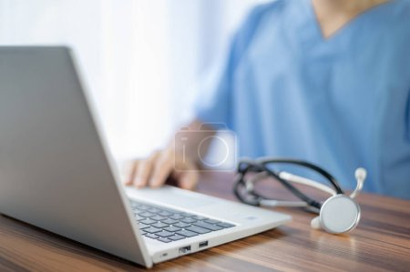 Photo for Doctor using computer working in hospital, Doctor using computer checking data patient document, Doctor using computer for health care hospital background - Royalty Free Image