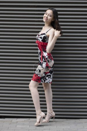 Téléchargez les photos : Beautiful young asian woman wearing red dress. Asian woman portrait. - en image libre de droit