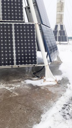 Photo for Vertical solar panels in winter, vertical photo - Royalty Free Image
