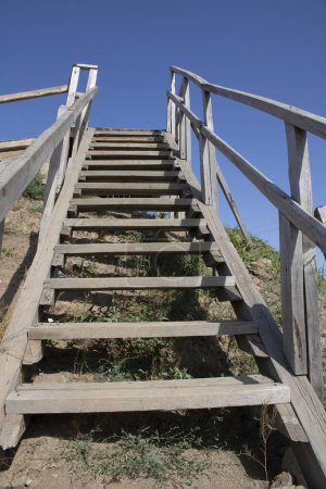 Photo for Steps of a wooden rustic staircase - Royalty Free Image