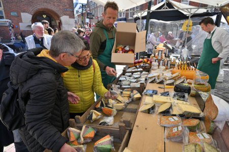 Photo for Alkmaar, Holland - April 22, 2022: various types of cheese for sale at traditional Cheese Market in Alkmaar, Holland - Royalty Free Image