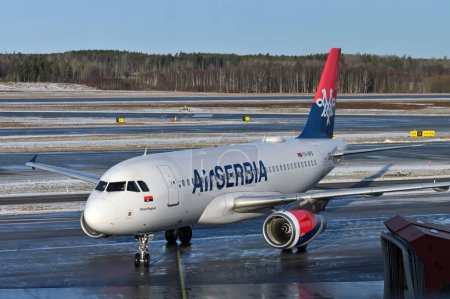 Foto de Stockholm, Sweden - February 13: Air Serbia Airlines Airbus A320-232 airplane on February 13, 2023 in Stockholm, Sweden - Imagen libre de derechos