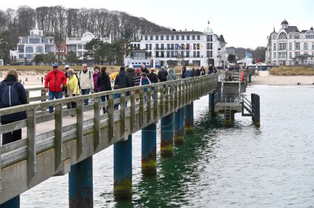 Photo for Rugen, Germany - April 13, 2023: Unidentified people walking on the beach bridge in Rugen island, Germany - Royalty Free Image
