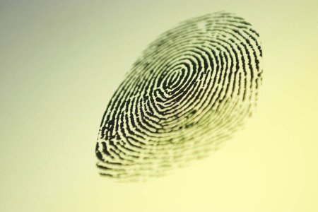 Photo for Black fingerprint on a yellow background - Royalty Free Image