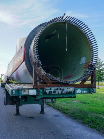 Photo for Low-loader semi-trailer with oversized used wind generator parts in the parking lot - Royalty Free Image