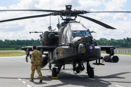 Photo for Liepaja, Latvia - August 07, 2022: AH-64D Apache attack helicopter from United States army after landing at the airport runway - Royalty Free Image