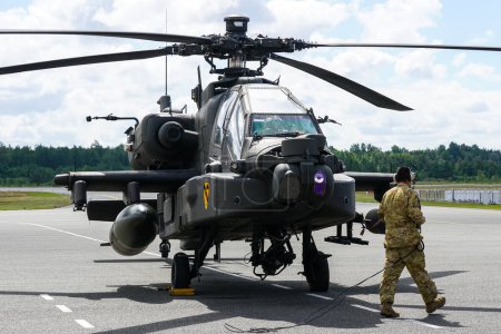 Photo for Liepaja, Latvia - August 07, 2022: AH-64D Apache attack helicopter from United States army after landing at the airport runway - Royalty Free Image