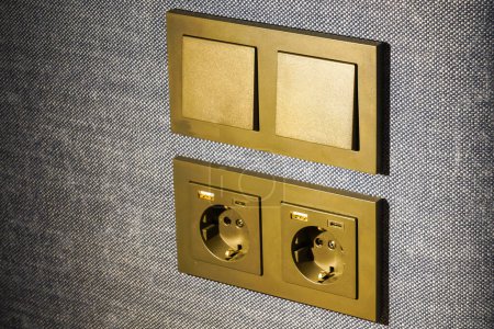 Téléchargez les photos : Light switches, 220V, USB and USB type C sockets are built into the fabric surface of the upholstered furniture - en image libre de droit