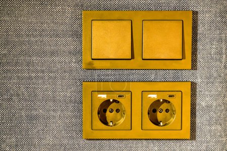 Téléchargez les photos : Light switches buttons, 220V, USB and USB type C sockets are built into the fabric surface of the upholstered furniture - en image libre de droit