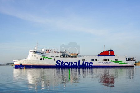 Photo for Liepaja, Latvia- May 09, 2023: Stena Line ferry Stena Flavia leaves Liepaja port, built 2008, length 186,5m, laden with passengers, cars and trucks - Royalty Free Image