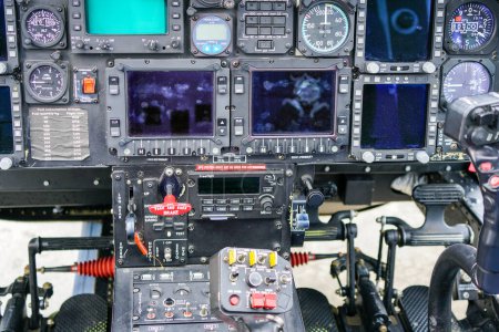 Photo for Interior view of helicopter Agusta cockpit with control pedals, dashboard, displays, selected focus, helicopter control panel, copter dashboard - Royalty Free Image