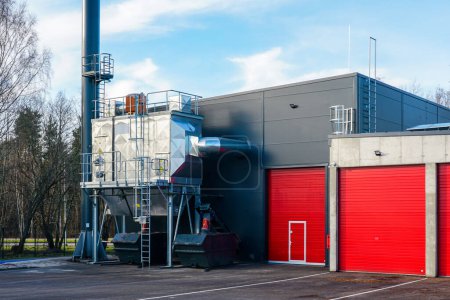 New modern wood chip biofuel boiler house for increased heat energy production efficiency from renewable energy resources, modern heat power plant
