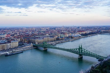 Danube river with Liberty bridge or Freedom bridge in Budapest, embankment with city panorama, view from Gellert hill