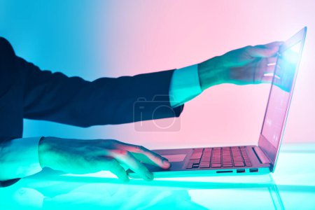The hands of a male business analyst work on a laptop managing business processes. Modern business technologies. Business concept.