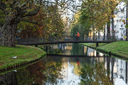 Photo for Rotterdam, The Netherlands, November 12, 2022: bridge for pedestrians and cyclists acros Westersingel canal in autumn - Royalty Free Image