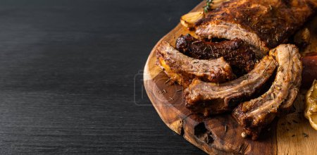 Photo for Juicy hot grilled ribs from a summer barbecue in nature. - Royalty Free Image