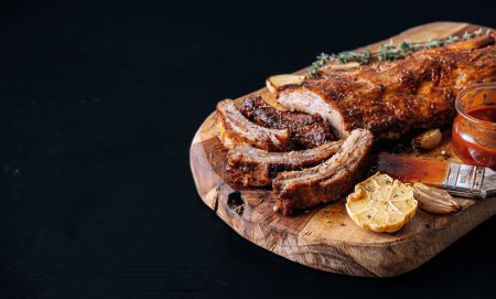 Photo for Smoked BBQ Ribs from a summer barbecue in nature. - Royalty Free Image