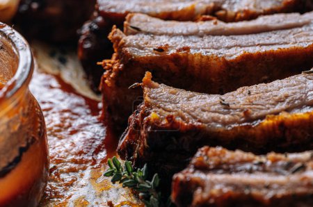 Photo for Smoked BBQ Ribs from a summer barbecue in nature. - Royalty Free Image