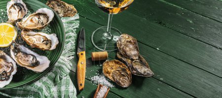 Photo for Fresh oysters with lemon ice and white wine. - Royalty Free Image