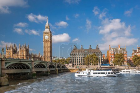Photo for Famous Big Ben with bridge over Thames and tourboat on the river in London, England, UK - Royalty Free Image