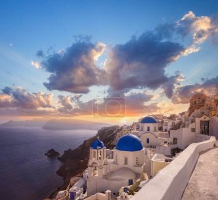 Photo for Oia village with churches against Aegean sea on Santorini island in Greece - Royalty Free Image
