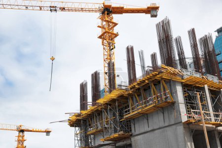 Foto de View of construction site with modern tower crane - Imagen libre de derechos