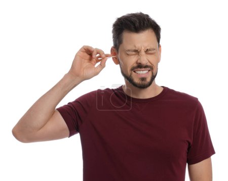 Photo for Man cleaning ears and suffering from pain on white background - Royalty Free Image