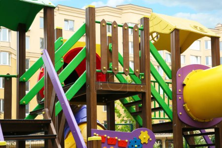 Foto de Colourful outdoor playground for children in residential area - Imagen libre de derechos