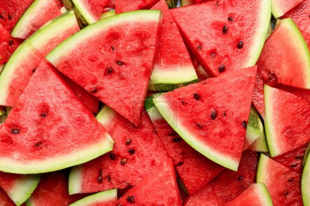 Scheiben saftig reifer Wassermelone als Hintergrund, Draufsicht