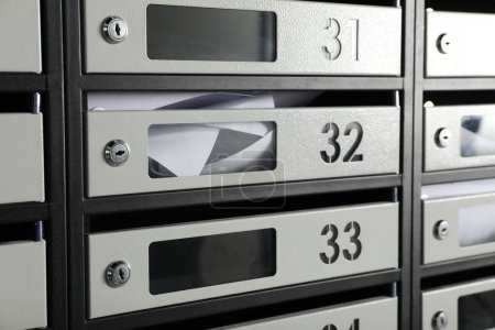 Photo for New mailboxes with keyholes, numbers and receipts as background - Royalty Free Image